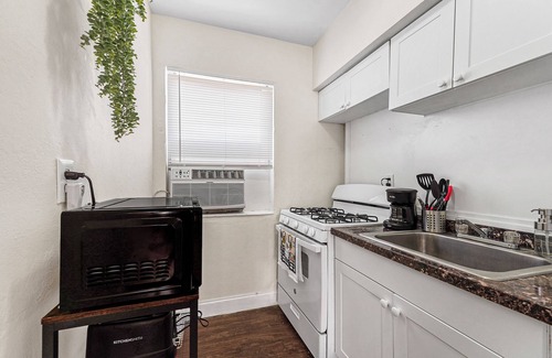 East Little Havana Apartment | Cozy 1BR in Little Havana near Brickell and Downtown. Features queen bed, Smart TV, full kitchen, free parking, Wi-Fi, and shared laundry. Great location close to highways and top attractions!