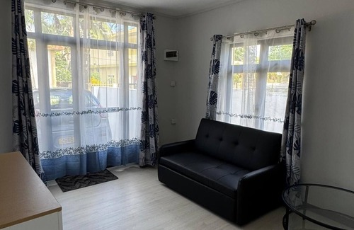 Roches Noires House | Cozy 2 bed-room house with beautiful front yard; 15 minutes to the beach.
