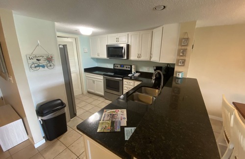 Sea Pines Condo | Cozy 2 bedroom with a gorgeous golf course view, 5 minute walk to the beach.