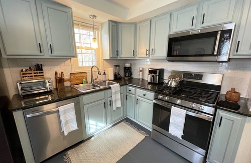Berea House | Cozy 4BR & 2 Bath-CLE, BW, IX Center-walkout basement - firepit - dog friendly!