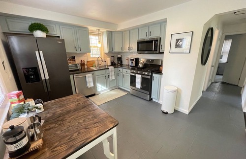 Berea House | Cozy 4BR & 2 Bath-CLE, BW, IX Center-walkout basement - firepit - dog friendly!