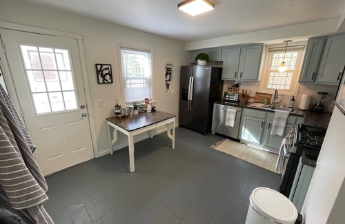 Berea House | Cozy 4BR & 2 Bath-CLE, BW, IX Center-walkout basement - firepit - dog friendly!