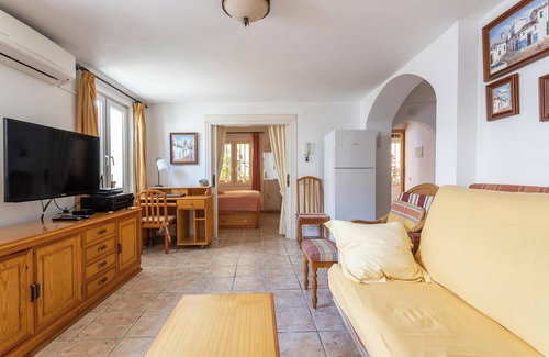Nerja City Centre Apartment | Cozy Apartment with Sunny Patio, Barbecue, Wi-Fi & Air Conditioning