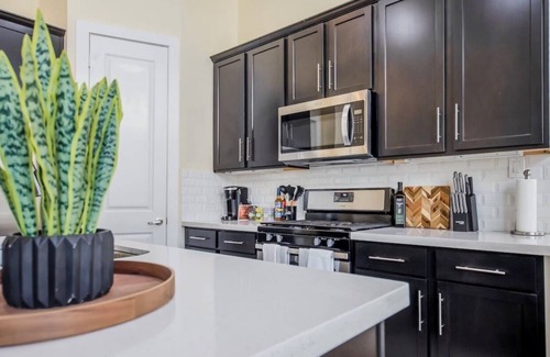 Greater East End House | Cozy boho themed 3-bedroom townhome in EADO