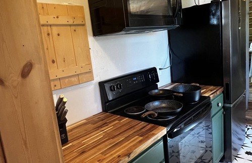 Bigfork Cabin | Cozy cabin bordering forest service trails. Perfect escape on 10 acres of forest