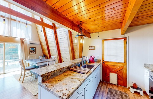 Groveland Cabin | Cozy Cabin | Farmhouse-style cabin in Groveland with gambrel knotty pine ceiling
