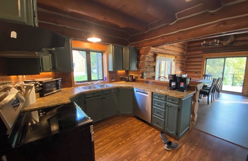 Pentwater Cabin | Cozy cabin on the serene Pentwater River with hot tub and ac