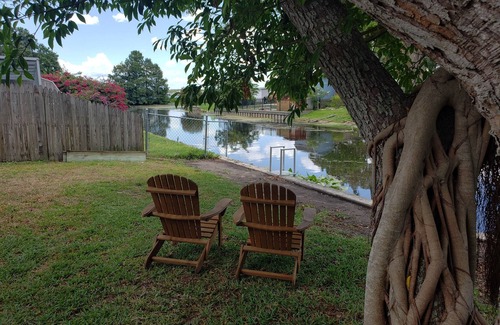Orange Lake Village House | Cozy Canal Cottage waterfront, nature experience. 15 minutes to the beaches.