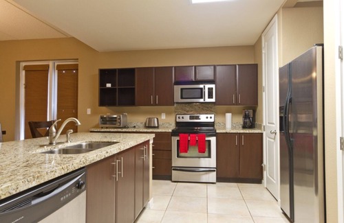 South Padre Island Condo | Cozy Condo on the Canal! Boat Slip, Heated Pool & Water Views - Walk to Clayton's!