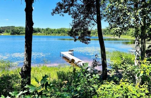 Stone Lake House | Cozy Lakefront Retreat with Game Room, Outdoor Living and Dock in Wisconsin
