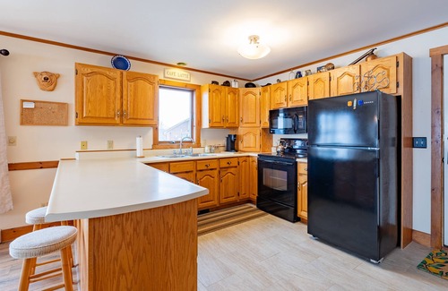 Newport Center Apartment | Cozy Lakeside Condo with a heated pool!