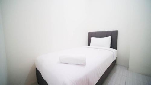 Surabaya Apartment | Cozy Living and Tidy 2BR at Puncak Dharmahusada Apartment By Travelio