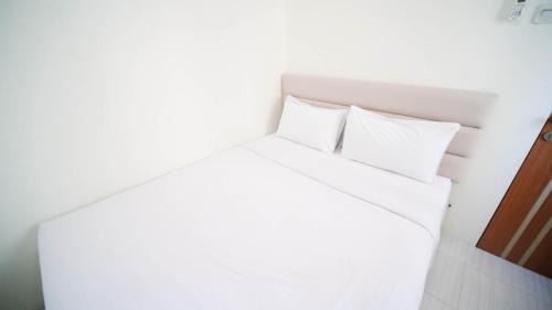 Surabaya Apartment | Cozy Living and Tidy 2BR at Puncak Dharmahusada Apartment By Travelio