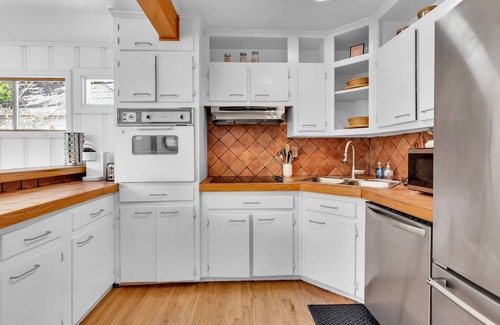 Loring Heights House | Cozy Midtown retreat with skyline views, private yard, deck, firepit, & W/D