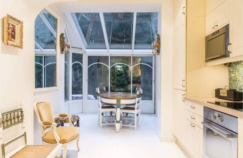 16th Arrondissement Apartment | Cozy Parisian style apartment with a veranda overlooking a private garden.