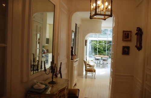 16th Arrondissement Apartment | Cozy Parisian style apartment with a veranda overlooking a private garden.
