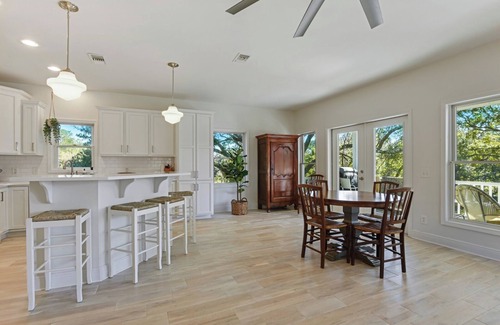 Henderson Point Cottage | Cozy Raised Cottage Overlooking Beautiful Bayou Mallini.