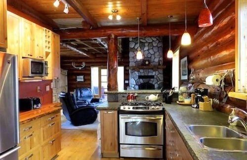 Otter Point Cottage | Cozy Rustic Log Home Living With Wood Fireplace And Hot Tub