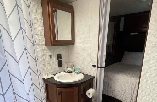 Aztec House | Cozy RV on working farm. 1 bedroom with queen size bed, 2 twin size beds.