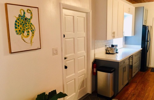 Alice Town House | COZY SEASIDE 2 BED/2 BATH BIMINI COTTAGE-BAY SIDE VIEW -soft green colored house