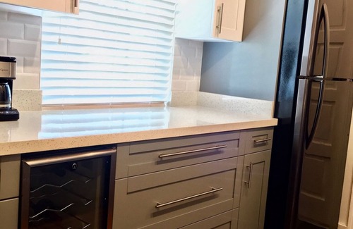 Alice Town House | COZY SEASIDE 2 BED/2 BATH BIMINI COTTAGE-BAY SIDE VIEW -soft green colored house