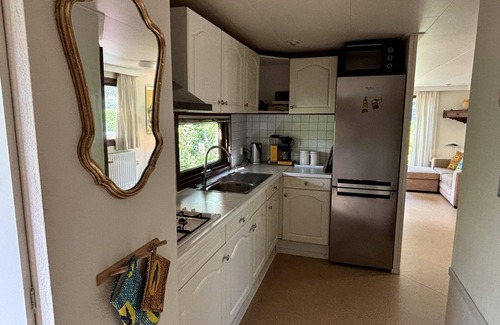 Municipality of Harderwijk House | Cozy Tiny Lodge (48 m²) for 2-3 persons (2 adults and 1 child) with basic facilities, garden and terrace.