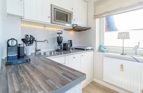 Westerland Apartment | Cozy vacation apartment for max. 2 persons with balcony and view of the dunes.