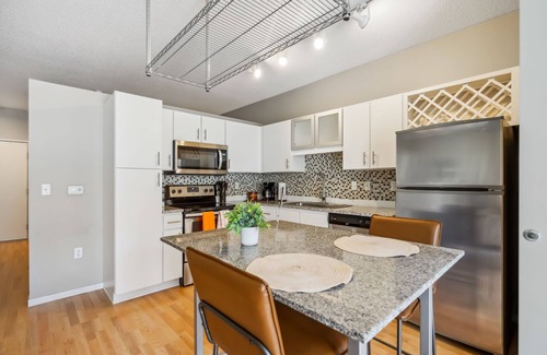 Mill District Apartment | CozySuites Mill District with pool, gym #03