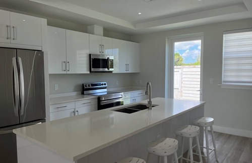 Palm Cay Condo | Create Lasting Family Memories by the Beach-Pool, Playground, and Water Sports!