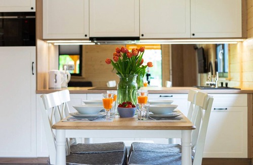 Lubrza House | Create lasting vacation memories in this inviting cottage near the lake.