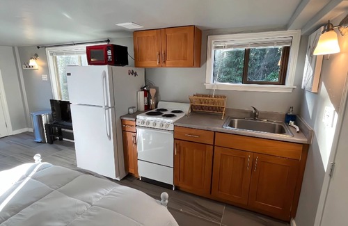 Greenwood Apartment | Creek-Front Crown Hill Craftsman MIL with Hot Tub - Unit B