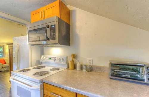 Greenwood Apartment | Creek-Front Crown Hill Craftsman with Hot Tub - Unit A