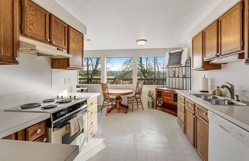 Lacey House | Creekside charmer with kayaks, fireplace, large deck, & W/D - dog-friendly