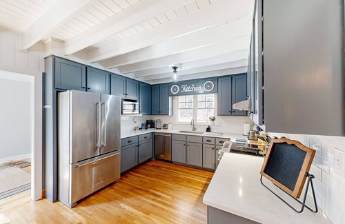 Forsyth House | Creekside home with firepit, yard games, deck, wood stove, & W/D