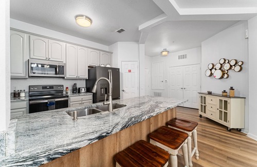 Florida Central Atlantic Coast Condo | Crisp &Modern with Balcony next to the Orange County Convention Center-Sea World
