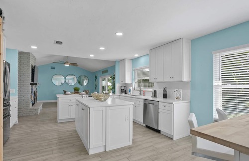 Palma Sola House | Custom coastal oasis with pool, game room, outdoor living, washer/dryer, & AC