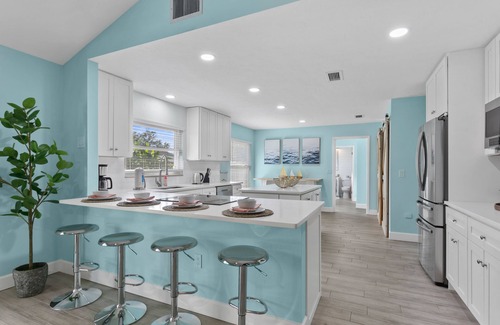 Palma Sola House | Custom coastal oasis with pool, game room, outdoor living, washer/dryer, & AC