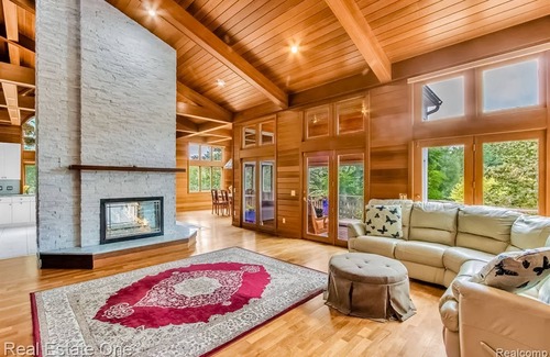 Metamora House | Custom dog-friendly home with private swimming area, fireplace, gym, grill, deck