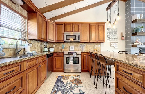 Whitney Beach House | Cute canal front Cottage with dock & boat lift and pool ,short walk to the beach