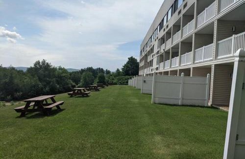 Weirs Beach Apartment | Cute Lower Level Cedar Lodge Room with Balcony & Lake Views!