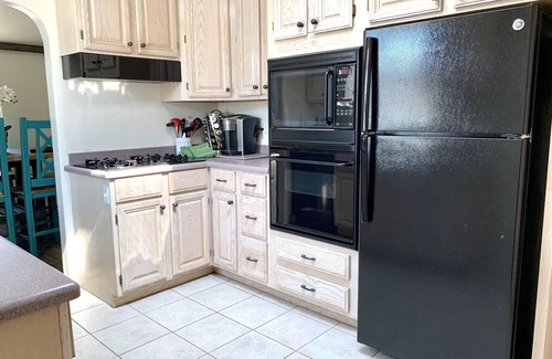 Crown Point House | Cute Spanish Bungalow - BBQ, Firepit, Bikes, Boards, and a Great Patio!