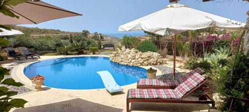 Kercem House | Dar Ta' Xmun - idyllic farmhouse with pool, garden, seaview & sunset