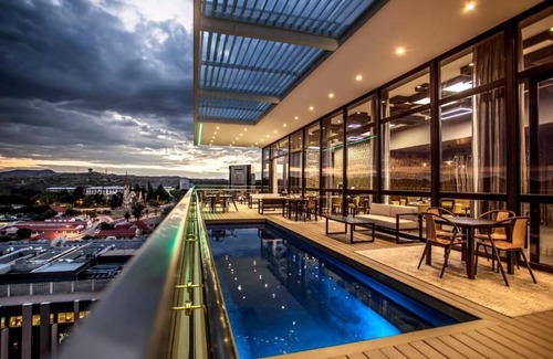 Windhoek Central Apartment | Delight in the Urban Views: Free Parking, Rooftop Pool, Near Alte Feste Museum!