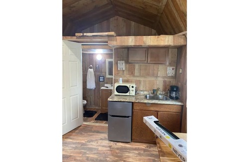 Smith County House | Delightful kitchenette style tiny home with loft.