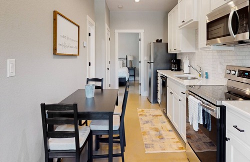 Kyle House | Delightful & modern duplex w/ patio, AC, & W/D - located near campus & shopping