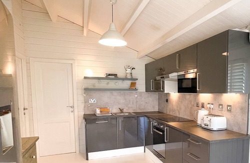 Abbess Roding Cottage | Delightful Private Wooden Lodge in 25 Acres