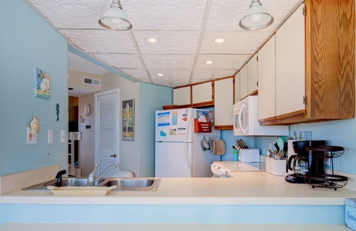 Sneads Ferry Condo | Delightful resort condo with partial ocean views, W/D, pool, gym, cabana