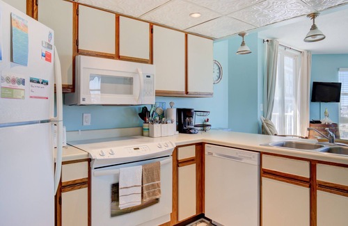 Sneads Ferry Condo | Delightful resort condo with partial ocean views, W/D, pool, gym, cabana