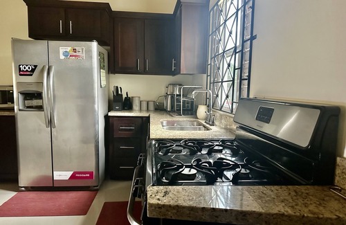 St. Ann's Bay House | Dell’s Exotic Haven n2 bedrooms, 2 baths, pool, gym