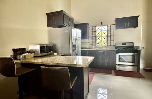 St. Ann's Bay House | Dell’s Exotic Haven n2 bedrooms, 2 baths, pool, gym